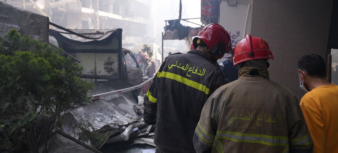 © UNHCR/Houssam Hariri Firefighters survey a scene of destruction in Beirut, Lebanon.